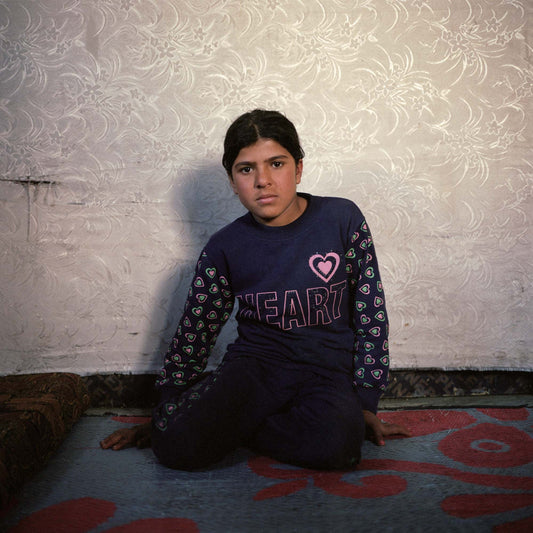 Basme (12)  in her parents' shelter in a Syrian refugee camp in the Bekaa Valley.